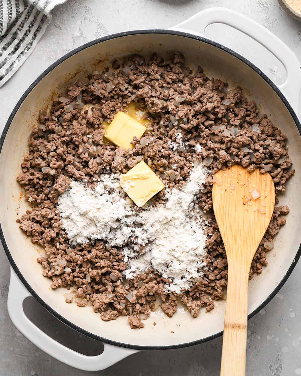 making Ground Beef Tortellini - flour and butter added to cooked ground beef before melting