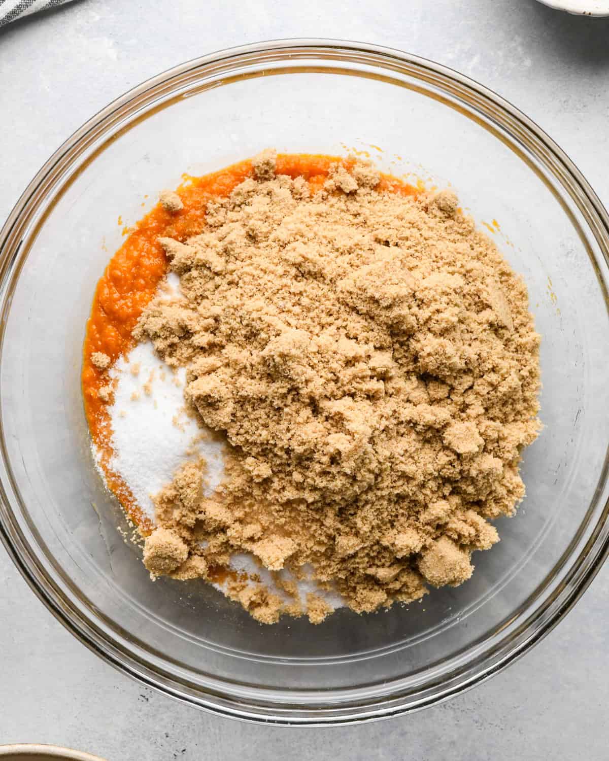 making Pumpkin Chocolate Chip Bread - brown and white sugar added to wet ingredients before mixing