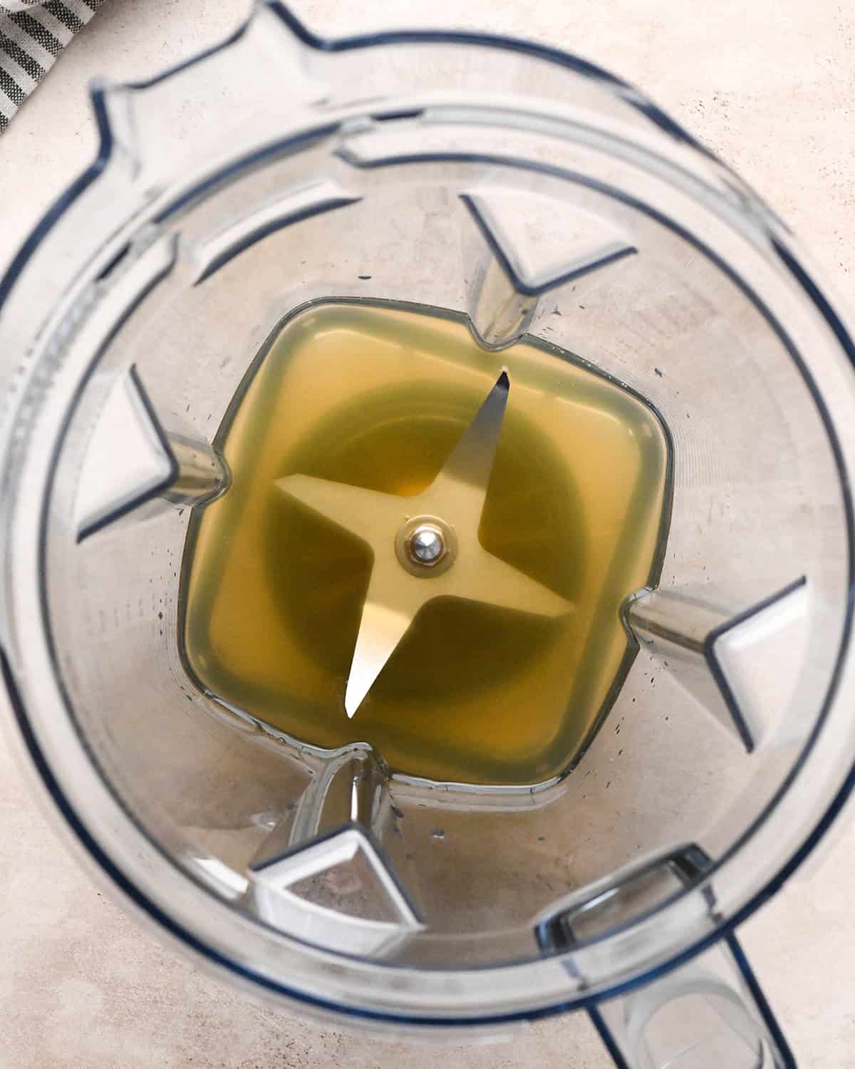 Making butternut squash risotto - chicken broth is put into a blender and set aside