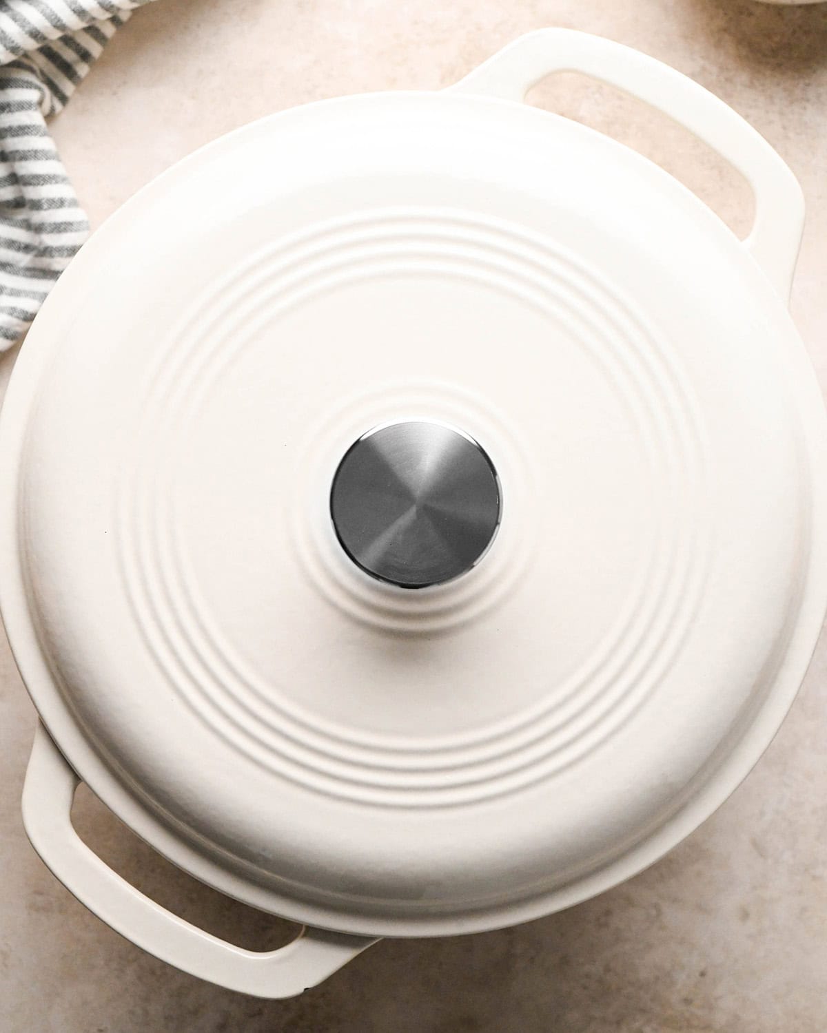 Making butternut squash risotto - butternut squash, garlic, onion, and butter in a white 5-quart saucepan, uncovered 