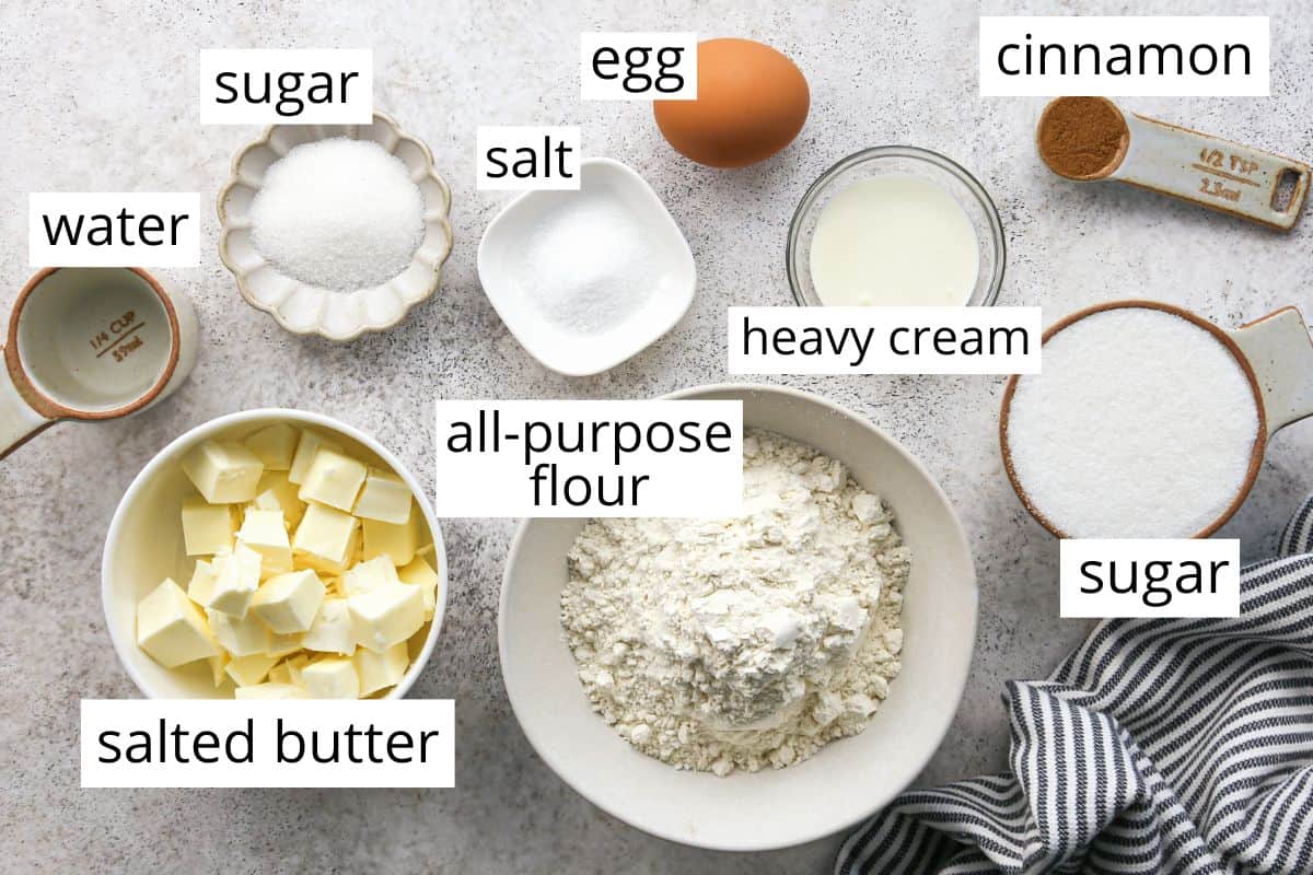 the labeled ingredients in this Pie Crust Cookies recipe measured out in bowl like butter, flour, sugar and egg
