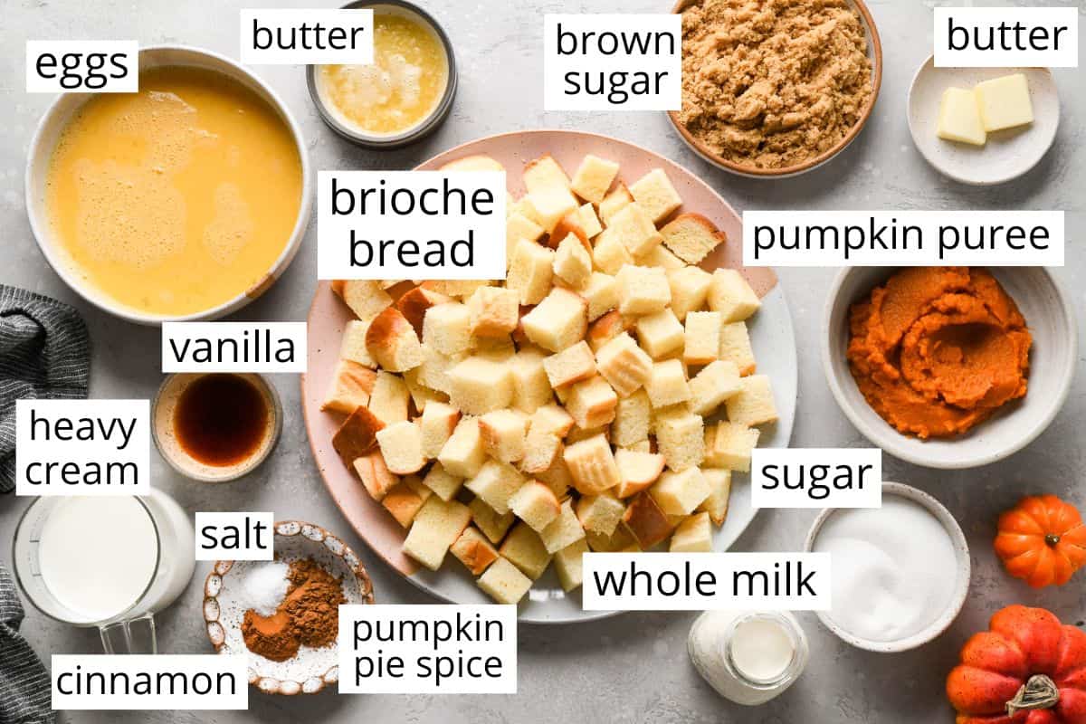 the labeled ingredients in this Pumpkin Bread Pudding recipe like cubed bread, eggs, pumpkin puree, milk, butter and cinnamon. 
