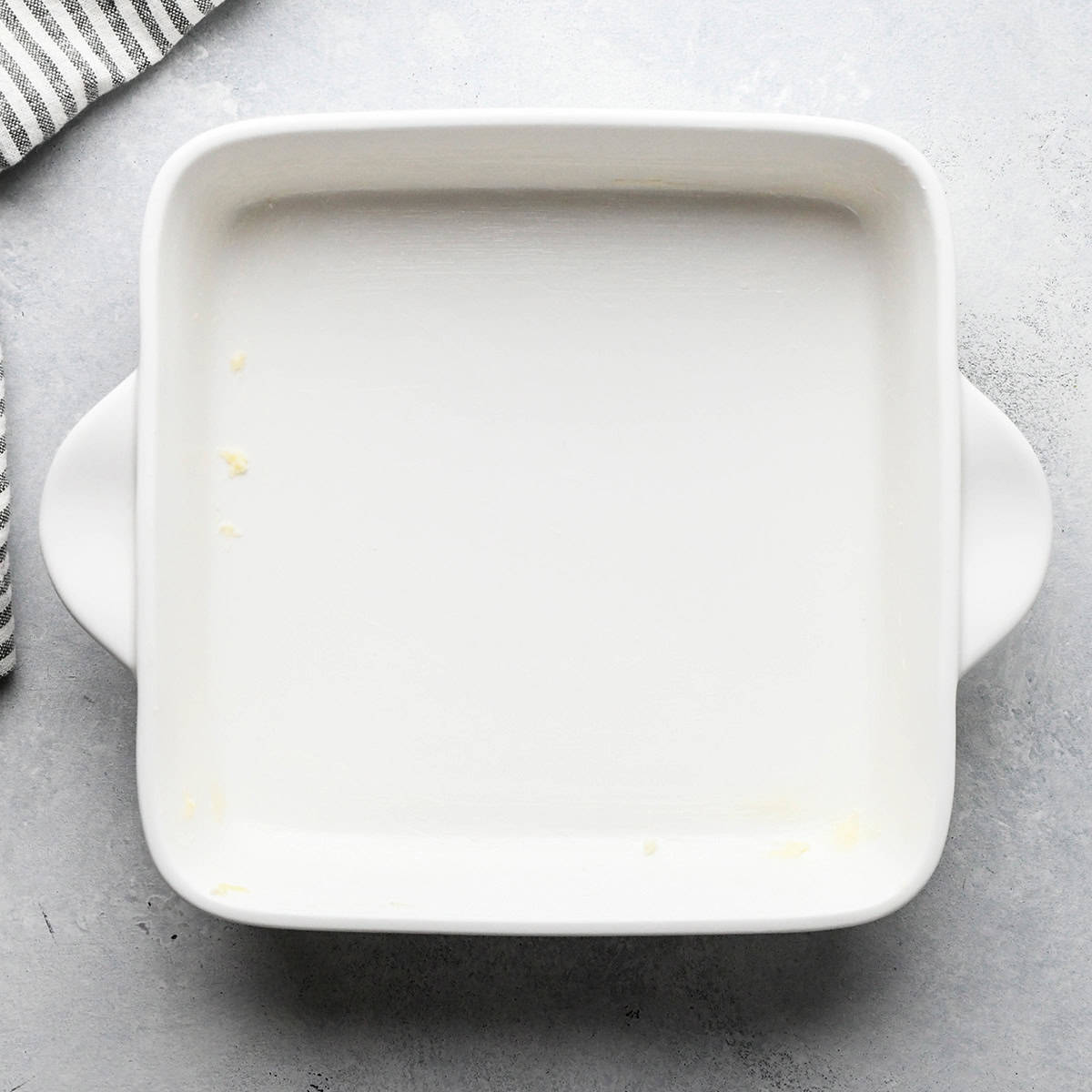 a greased 9x9" white baking dish