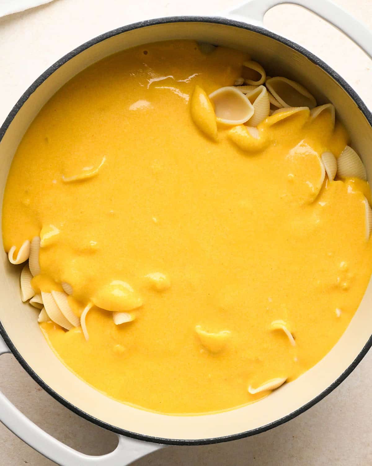 cook shell pasta added to the pumpkin mac and cheese sauce halfway through mixing