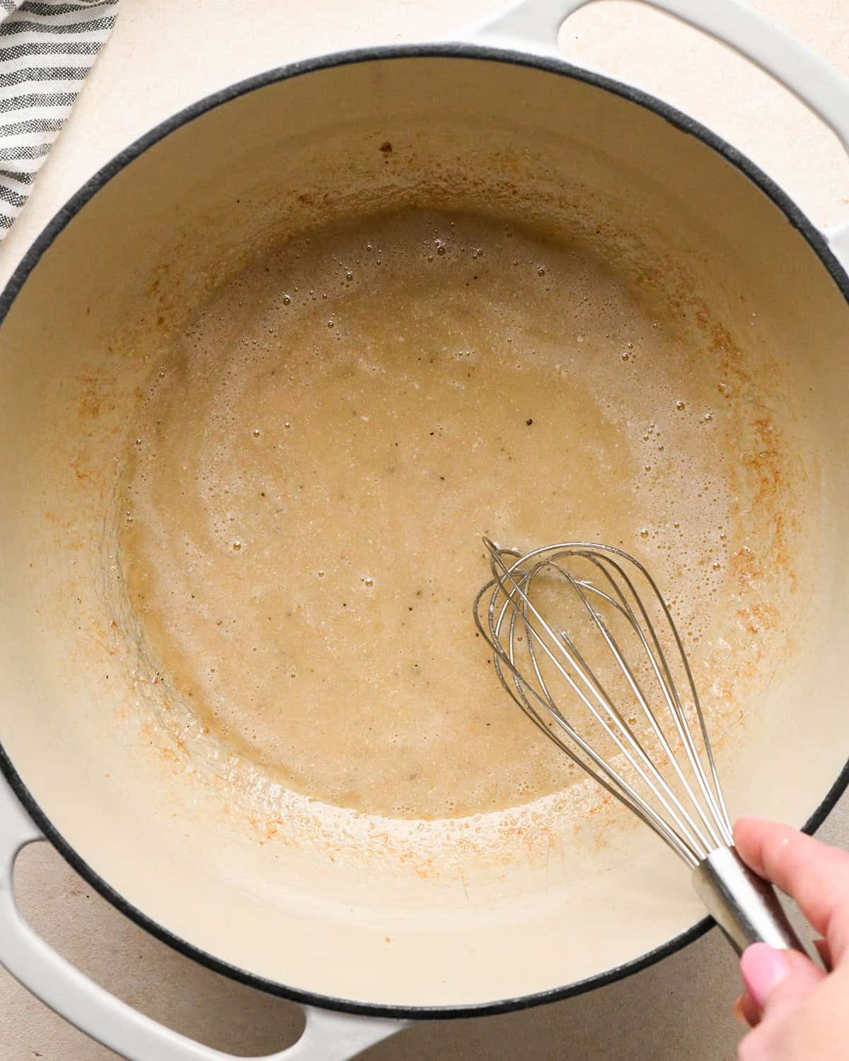 flour and bacon grease mixture in a pot after whisking