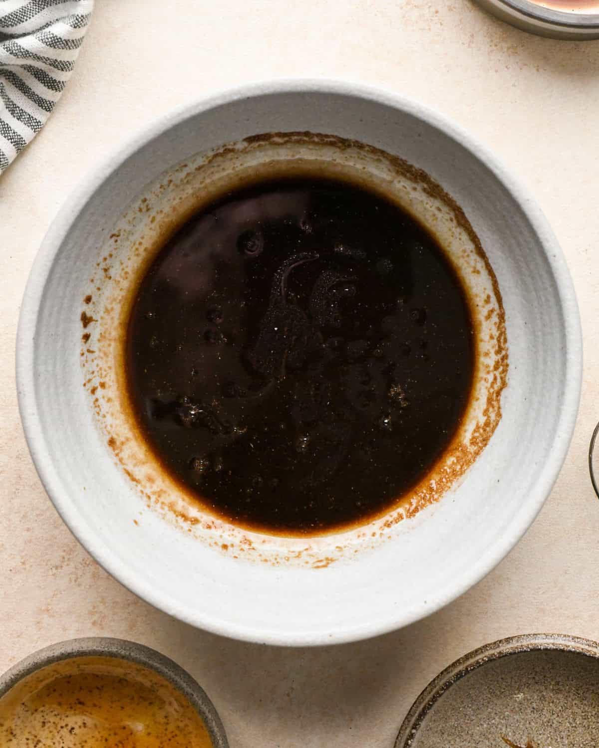 balsamic dressing in a small white bowl to use on this beet salad recipe