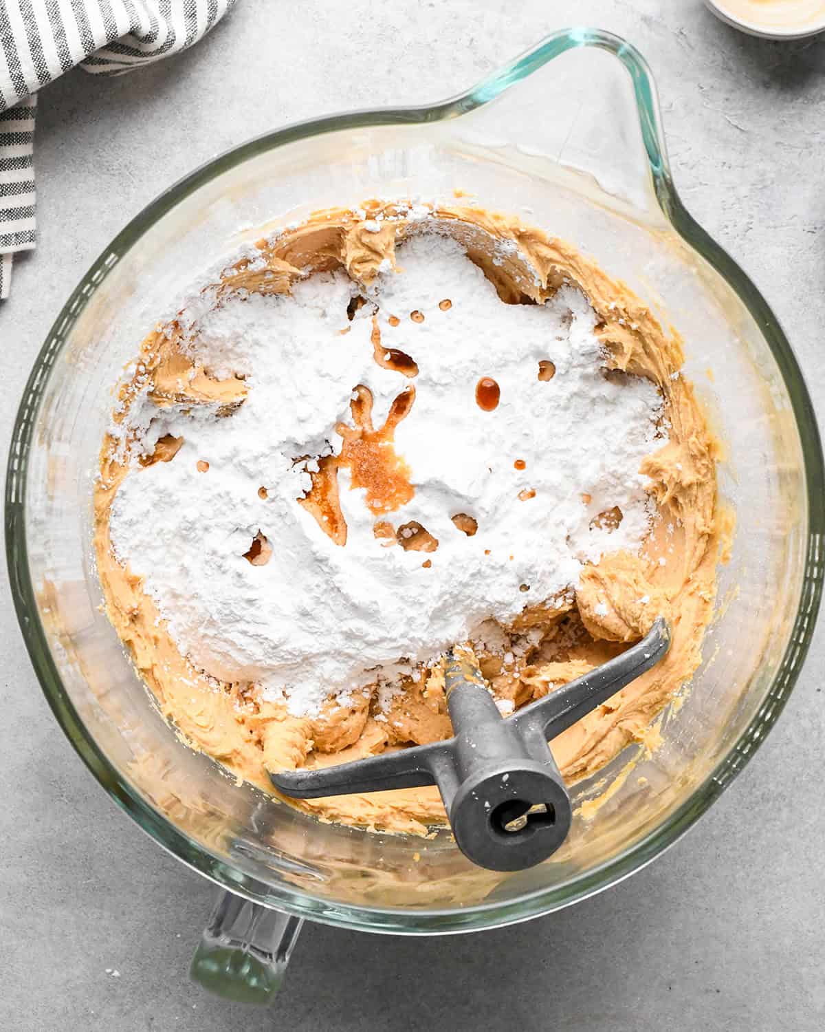 powdered sugar and vanilla added to the beaten peanut butter mixture in a glass bowl with the paddle attachment before mixing making chocolate peanut butter pie