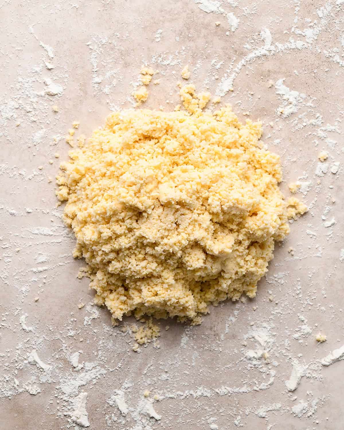 dutch apple pie crust dough on a floured surface before making into a disc