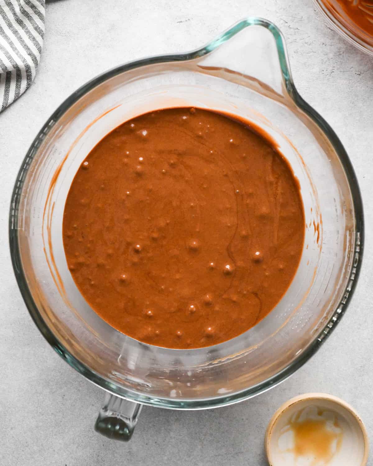 Making skillet brownies - chocolate and butter are added to egg mixture and mixed together