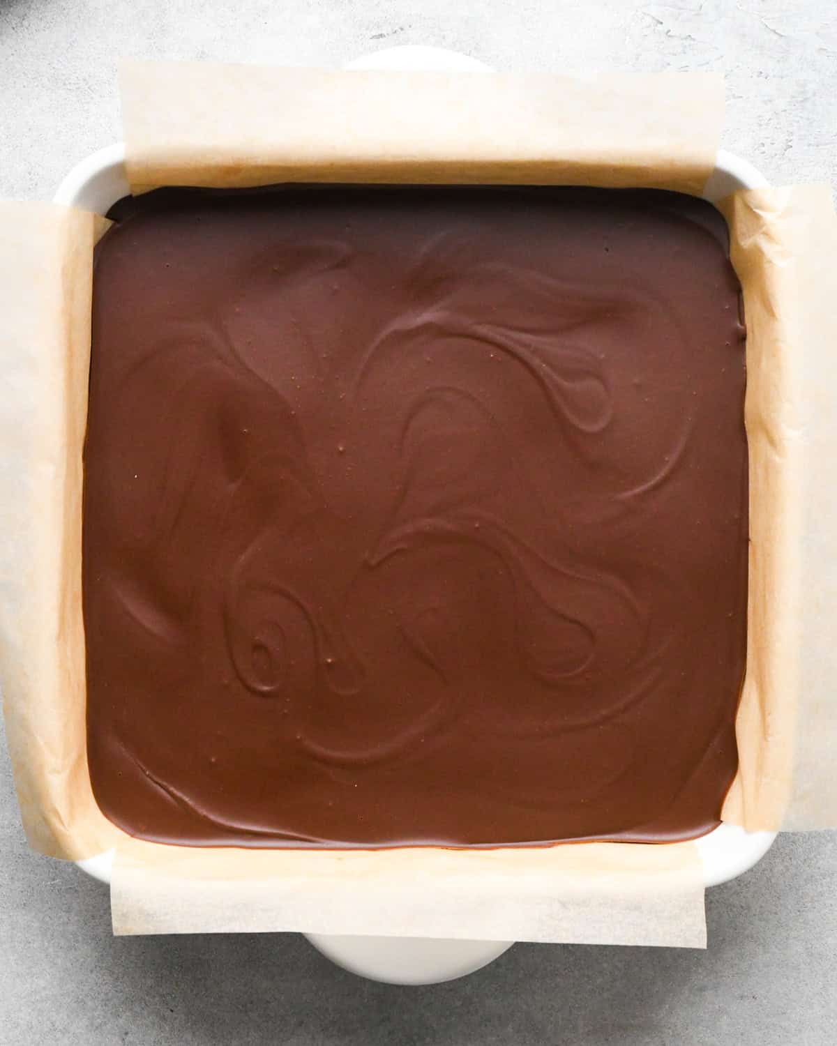 Making peanut butter oatmeal bars - overhead photo of peanut butter oatmeal bars with a chocolate peanut butter topping, chilled and ready to eat.