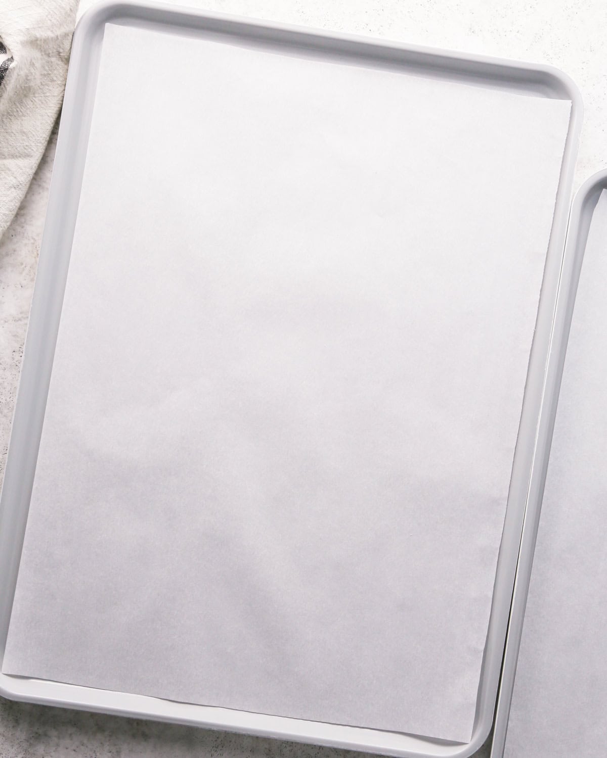 Overhead photo of a baking sheet lined with parchment paper.