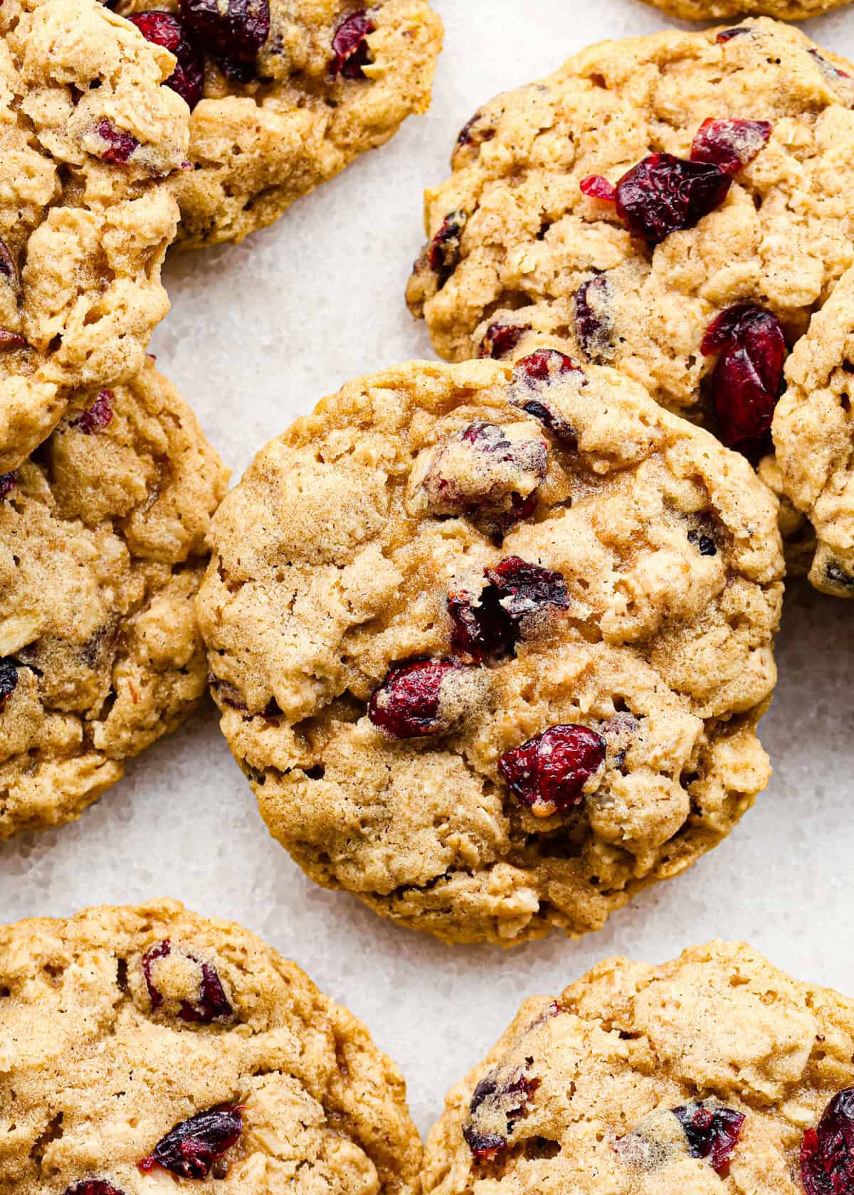 Overhead view of cranberry oatmeal cookies sitting on a countertop.