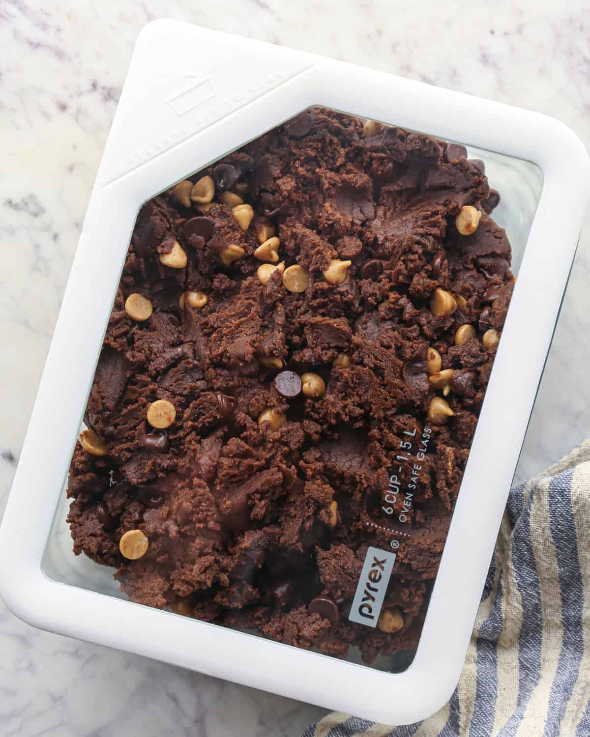 Making chocolate peanut butter chip cookies - photo of cookie dough in an airtight container for chilling.