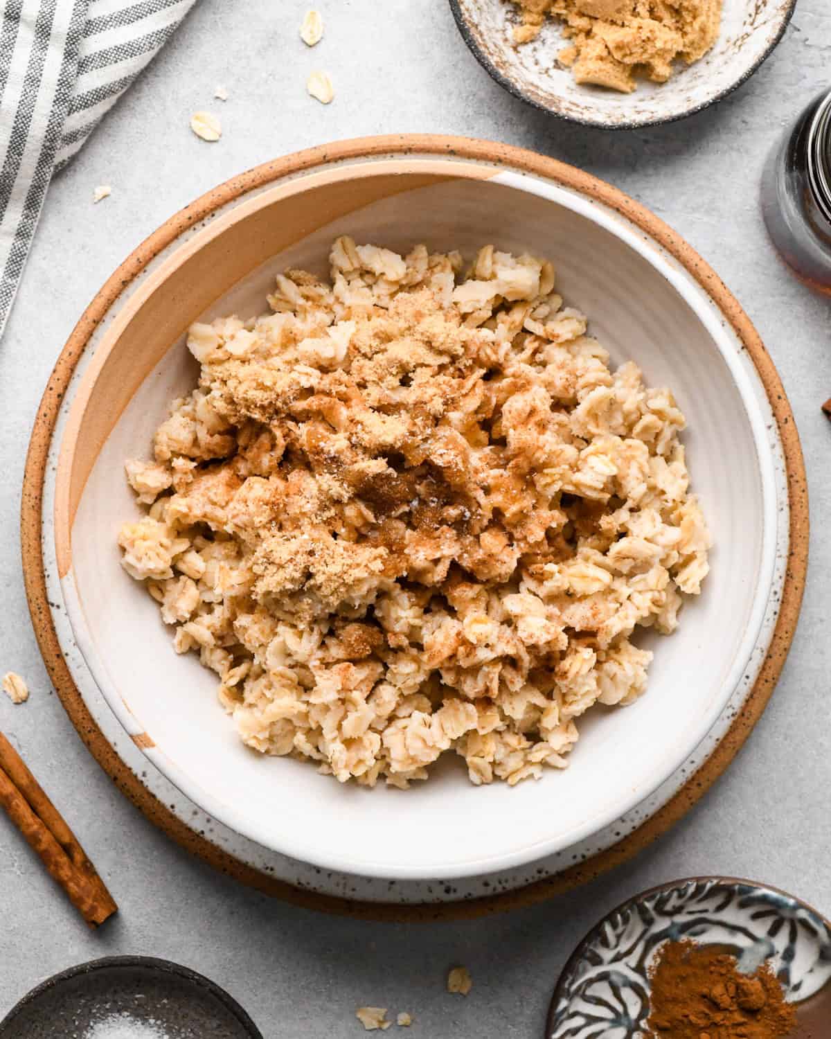 showing how to make oatmeal flavors - brown sugar and maple syrup on top of oatmeal in a bowl
