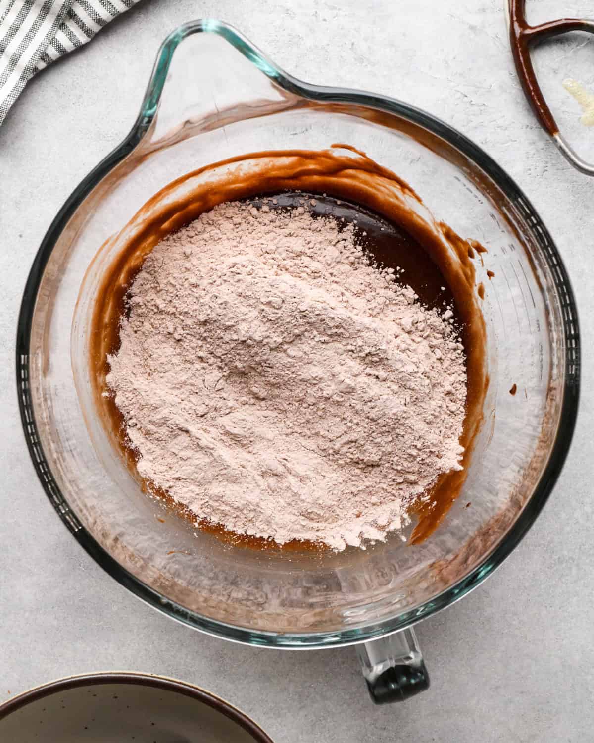 making cookie dough brownies - dry ingredients added to the wet ingredients before mixing