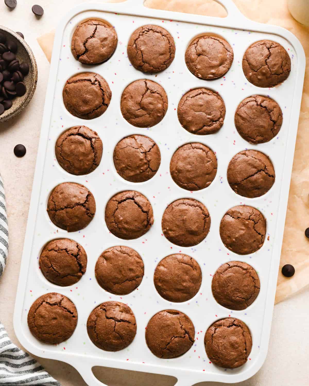 24 brownie bites in a white silicone mini muffin pan after baking