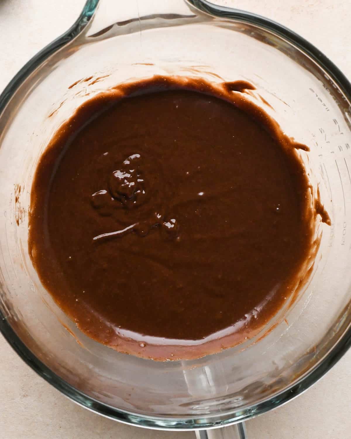 making brownie bites - wet ingredients combined in a glass mixing bowl