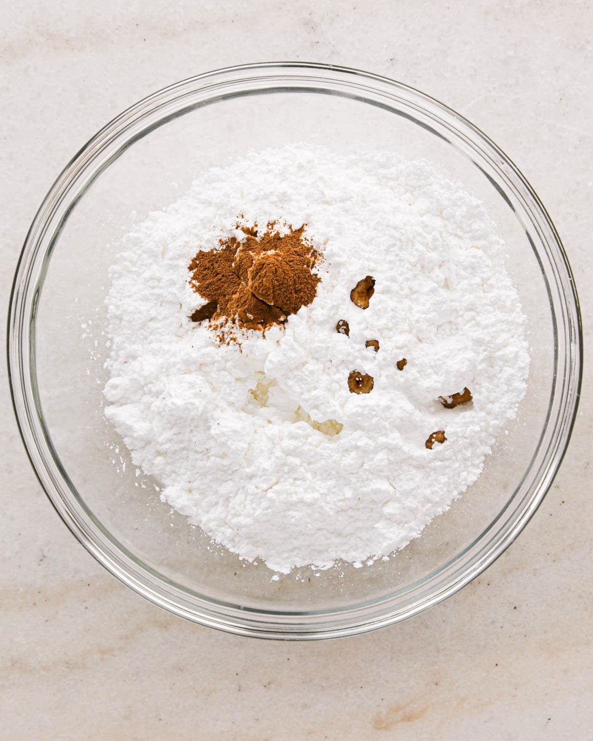 making cinnamon glaze for apple scones, ingredients in a glass bowl