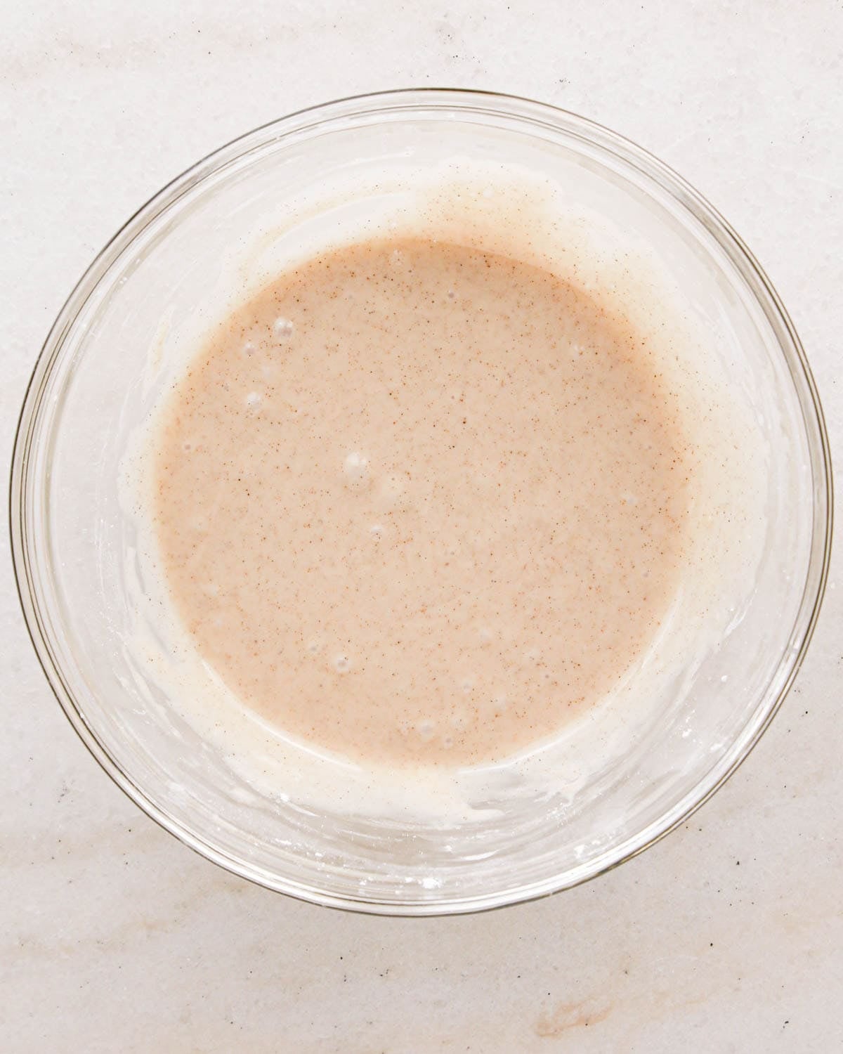 cinnamon glaze for apple scones in a glass bowl