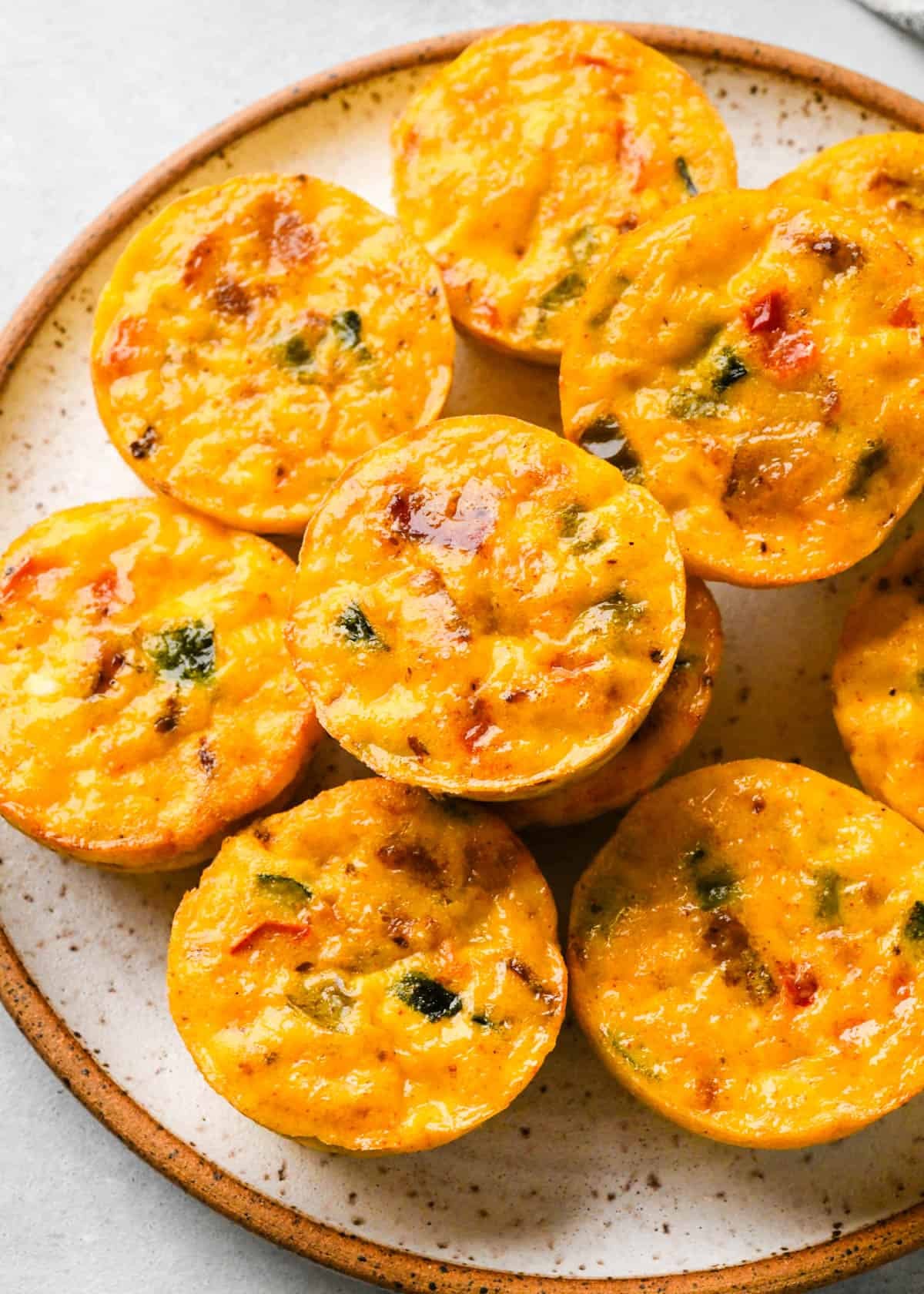 10 12 cottage cheese egg bites on a speckled pottery plate