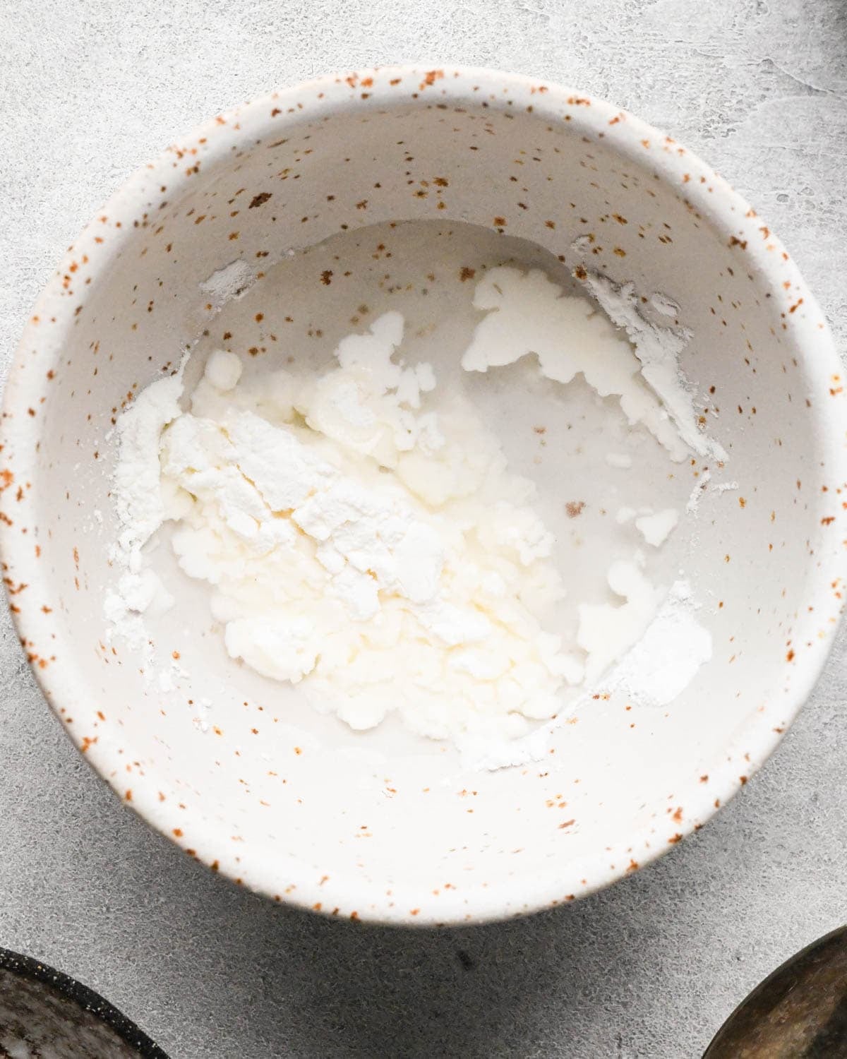 making ground beef stir fry - cornstarch and water in a small ceramic bowl before mixing