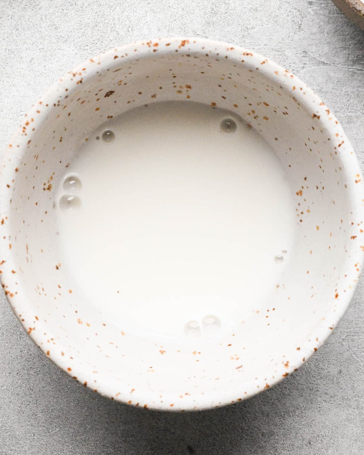 making ground beef stir fry - cornstarch and water mixture in a small ceramic bowl