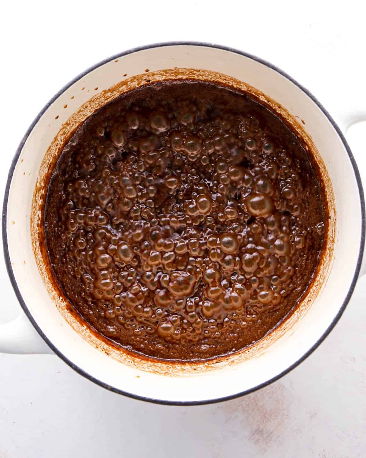 making birds nest cookies - wet ingredient mixture boiling in a white pot