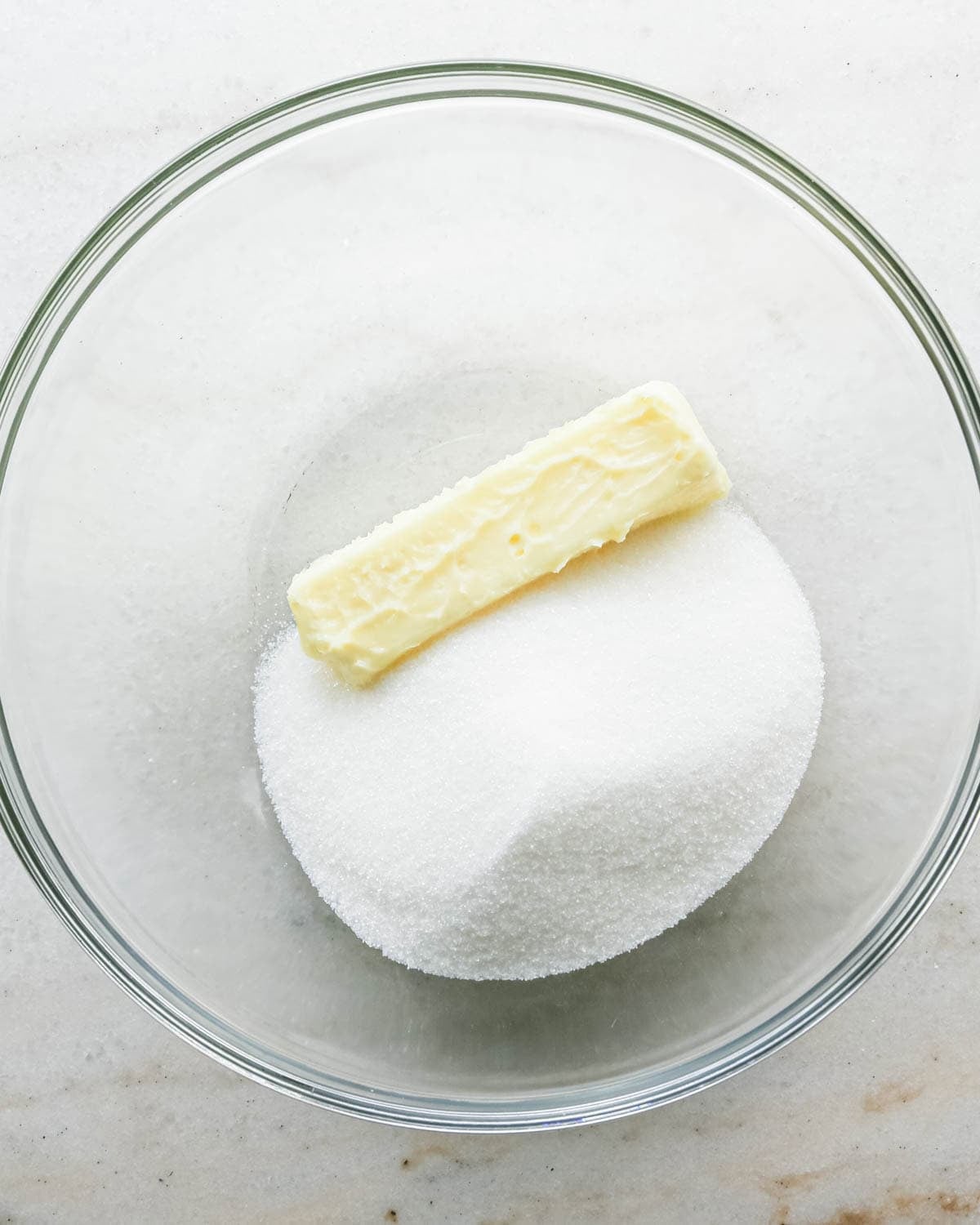 making strawberry cake - butter and sugar in a glass bowl before beating