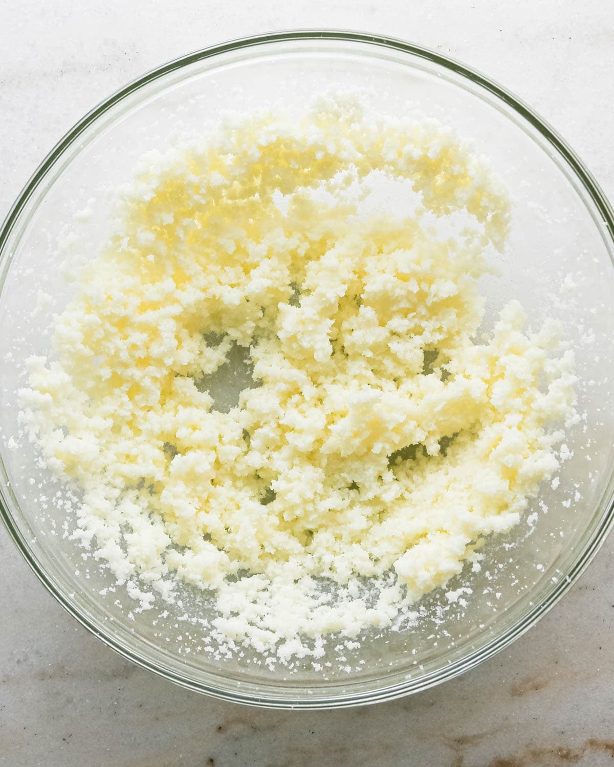 making strawberry cake - beaten butter and sugar in a glass bowl