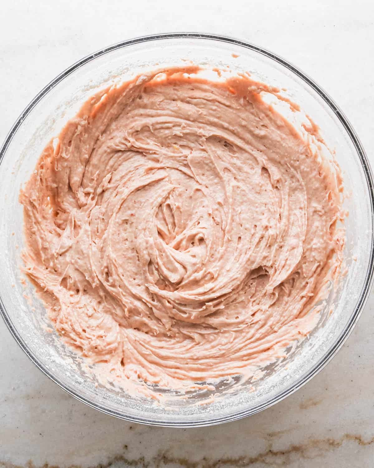 making strawberry cake - final cake batter in a glass bowl