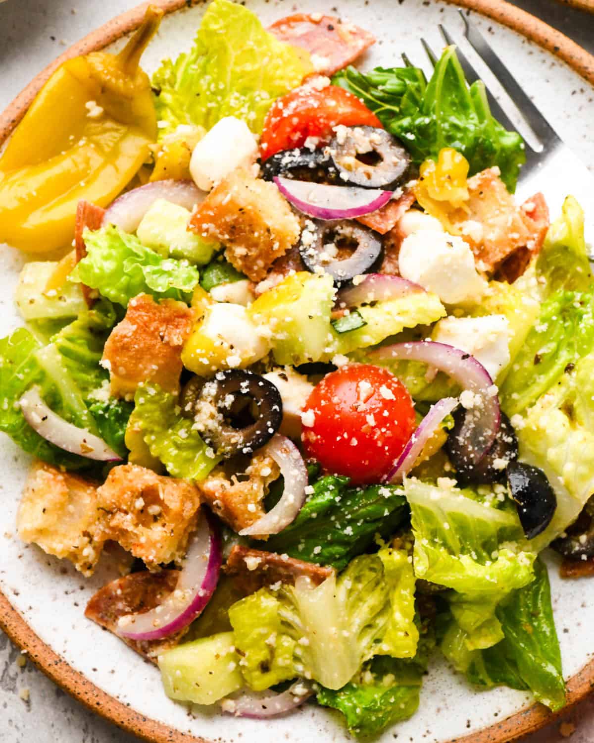 an individual serving of Italian salad on a plate