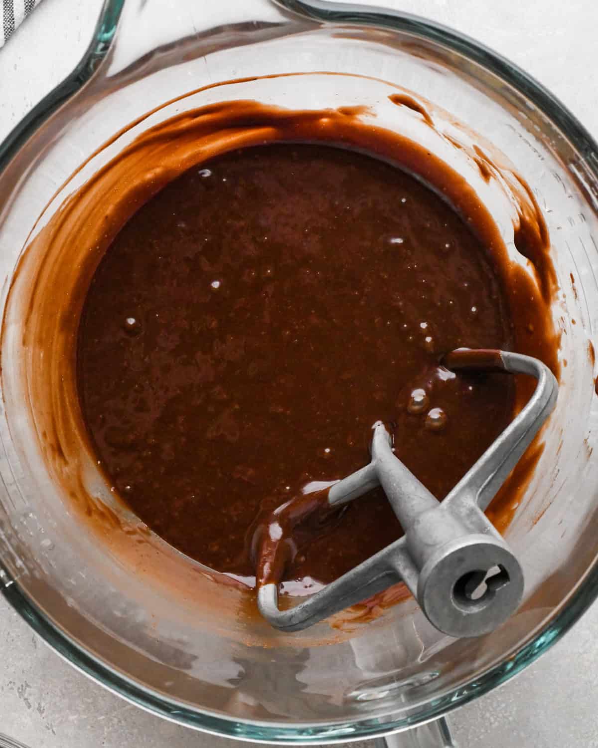 Making gluten-free brownies: overhead photo of chocolate brownie batter mixed together in a large mixing bowl.