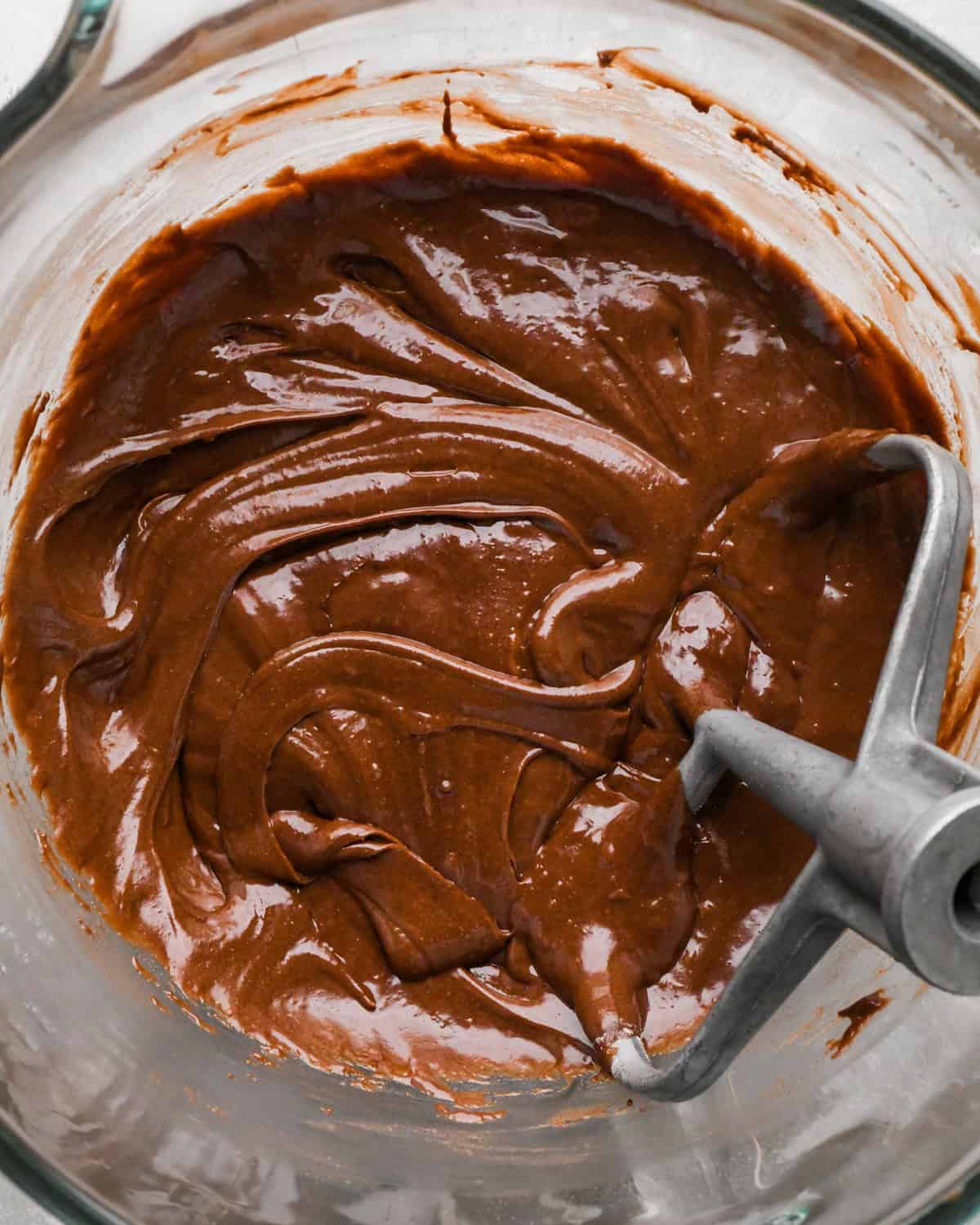 Making gluten-free brownies: overhead photo of final dry ingredients added to brownie batter in a large mixing bowl and mixed together.
