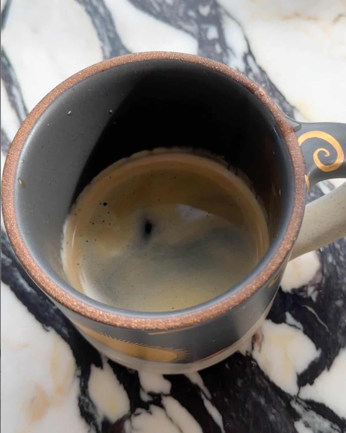 how to make a latte overhead photo of espresso shots brewed into a mug