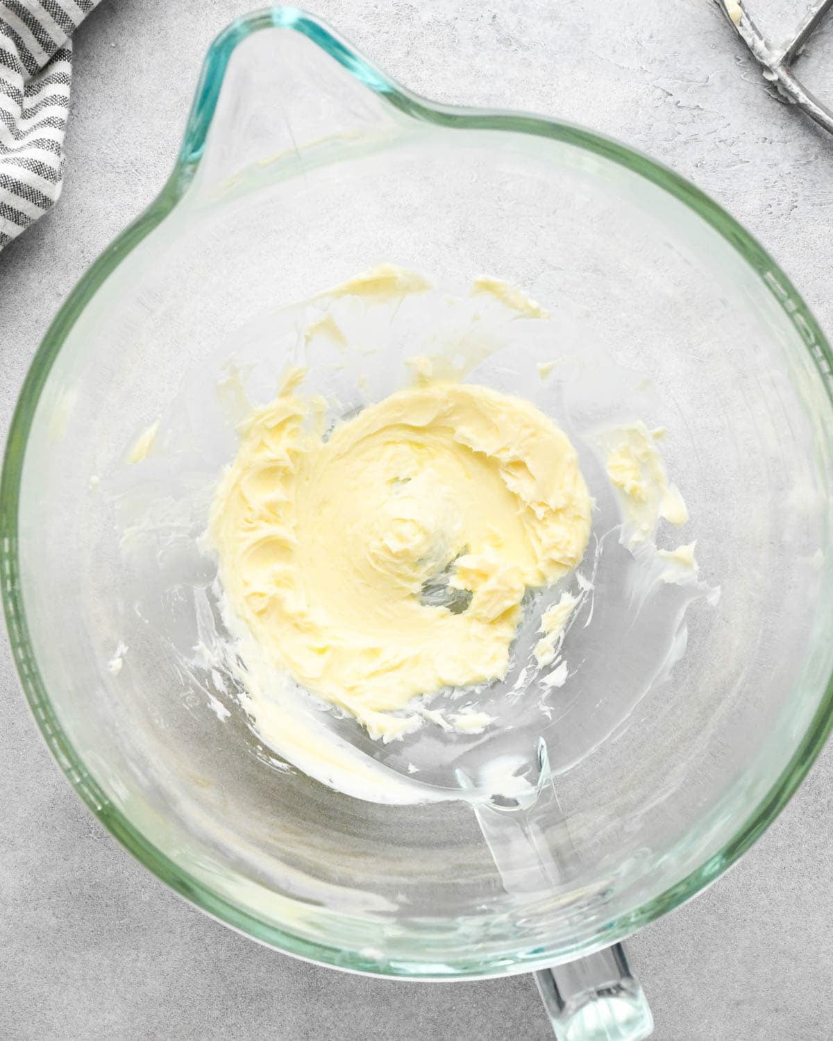 Making buckeye brownies: overhead photo of butter beaten in a glass measuring bowl.