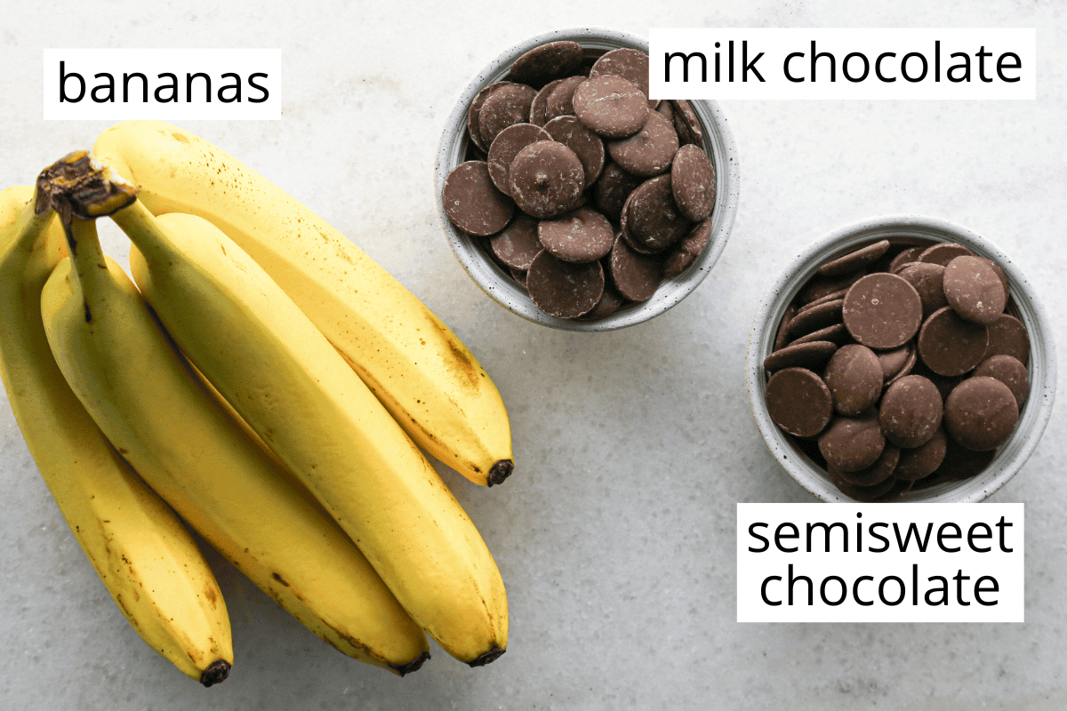 Overhead photo of the ingredients for chocolate dipped frozen bananas which include bananas, milk chocolate, and semisweet chocolate.