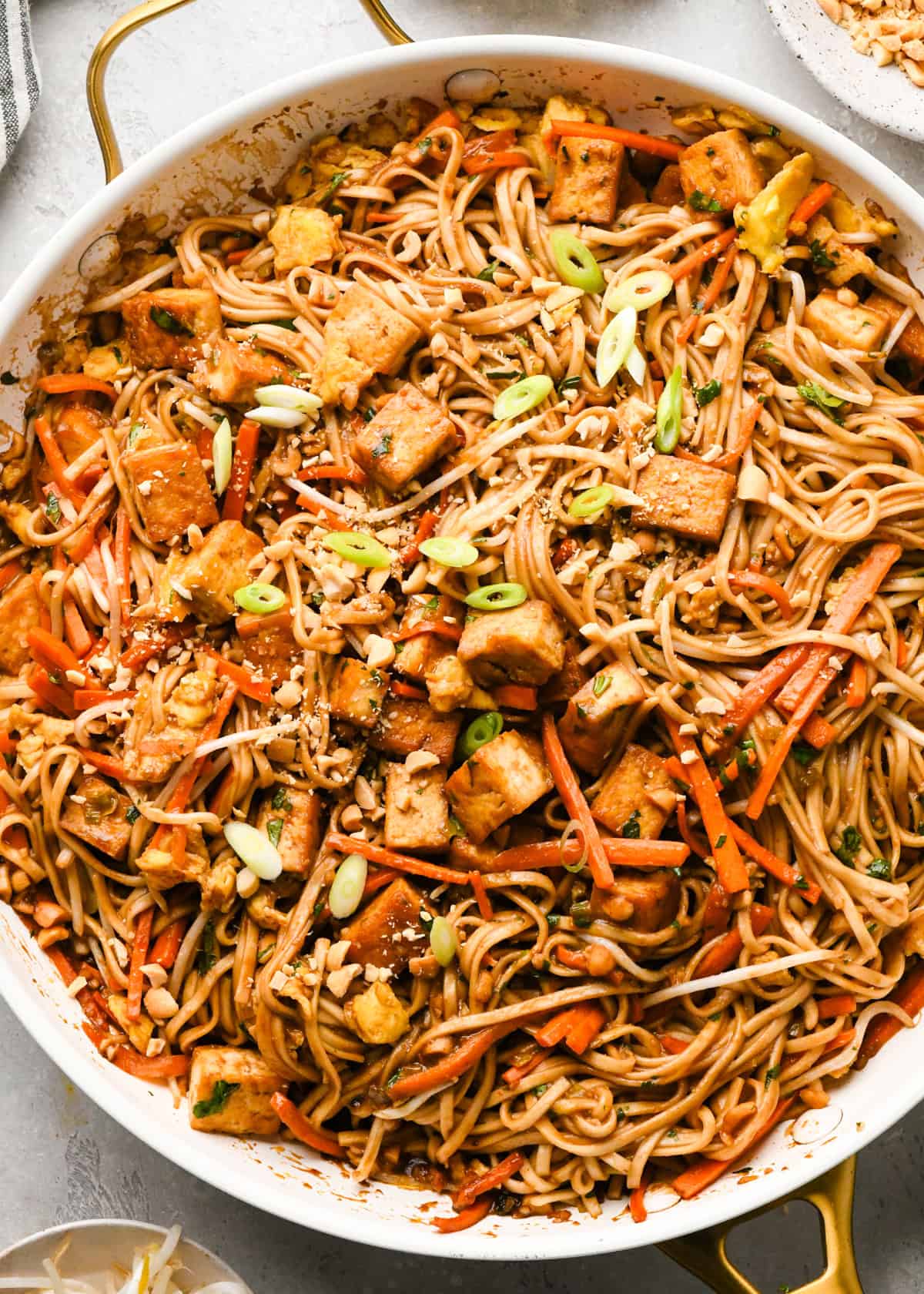 Making Pad Thai: overhead photo of completed Pad Thai shown in a white skillet and ready to serve.
