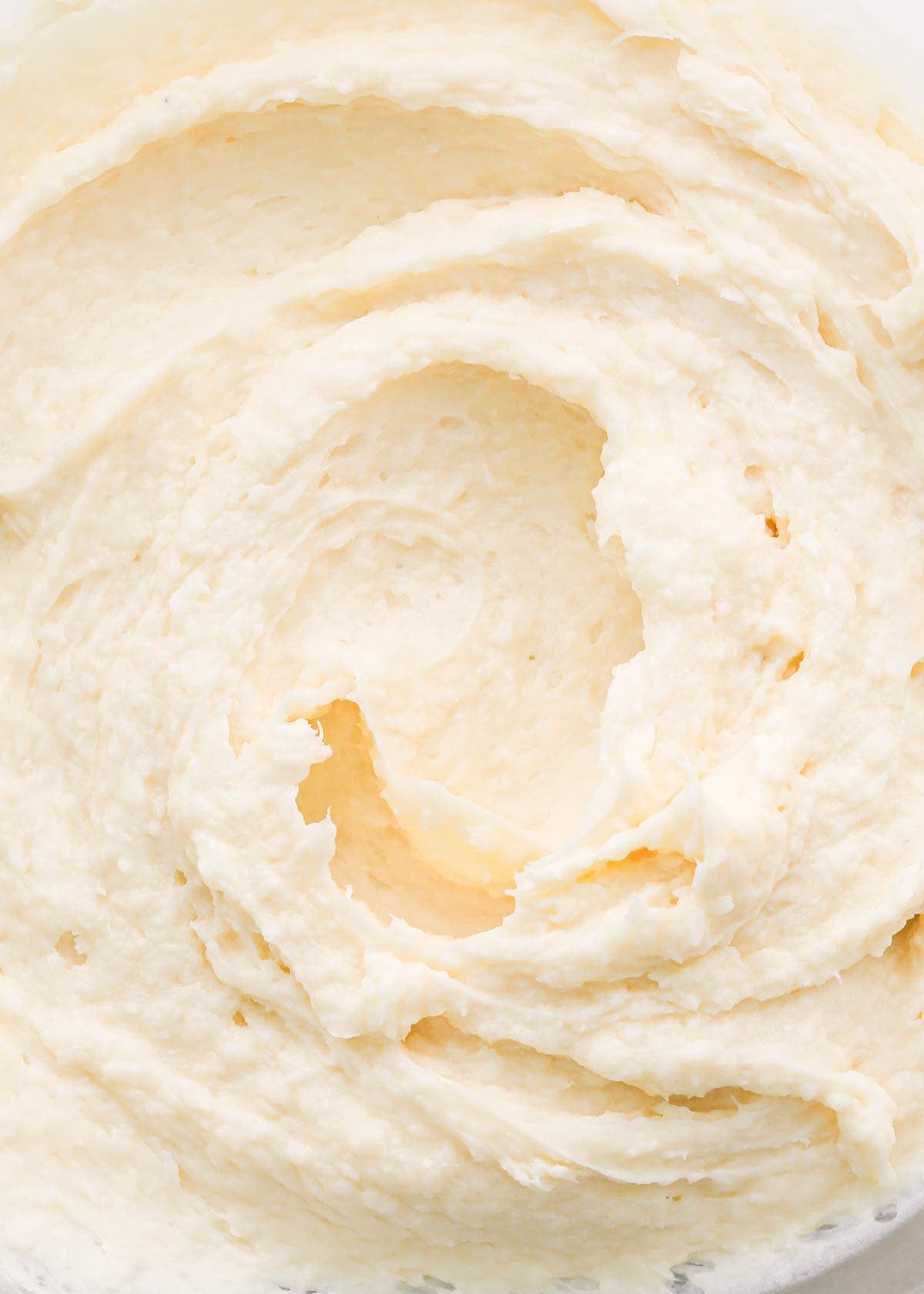 coconut frosting for coconut brownies in a glass bowl