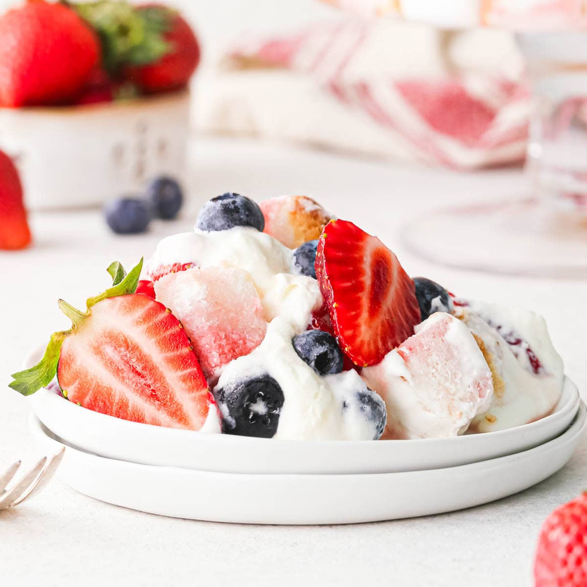 a serving of berry trifle on a white plate
