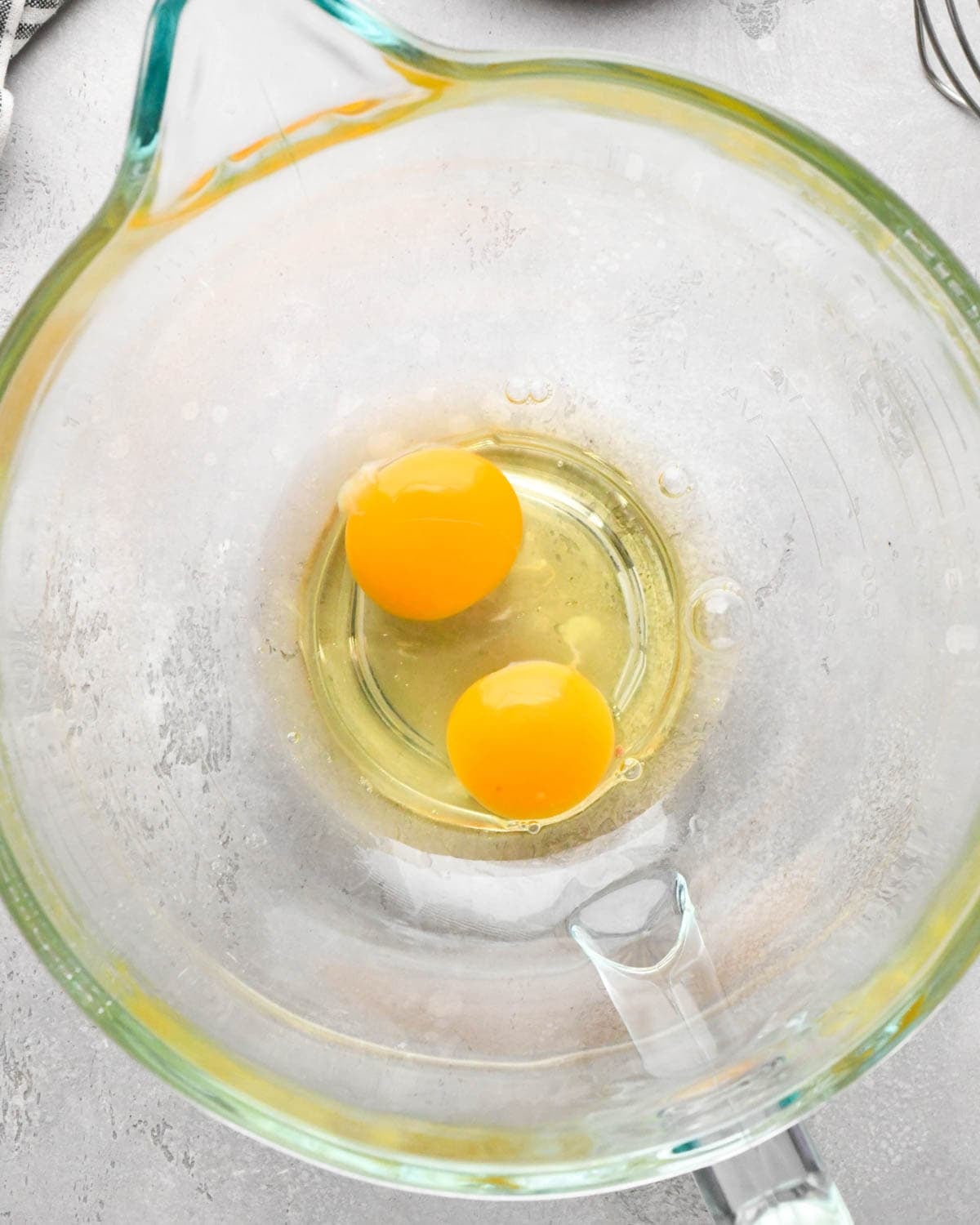 making brown butter brownies - two eggs in a glass mixing bowl