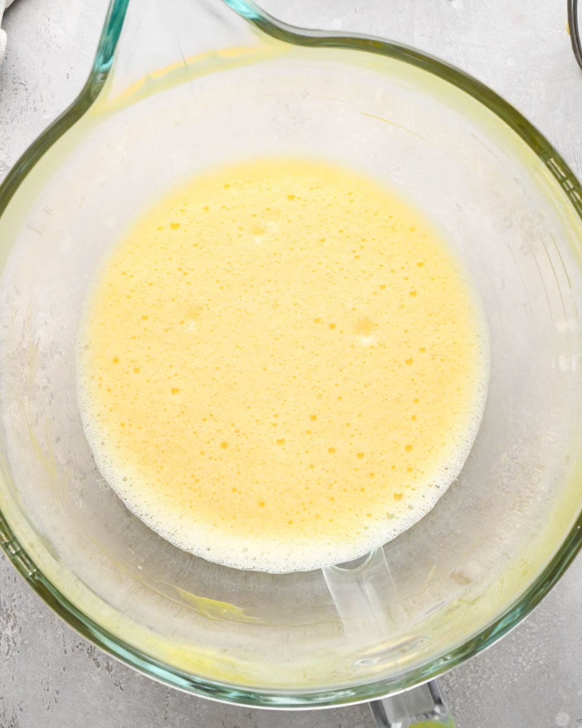 making brown butter brownies - two eggs beaten until foamy in a glass mixing bowl