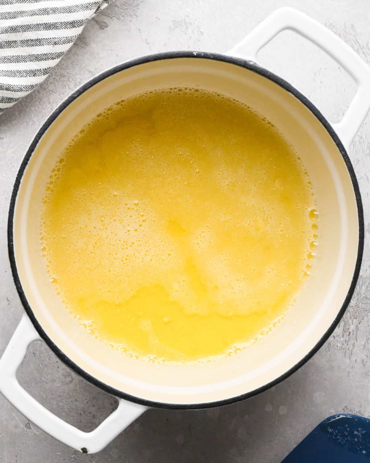 browning butter for brown butter brownies - melted bubbly butter in a pot