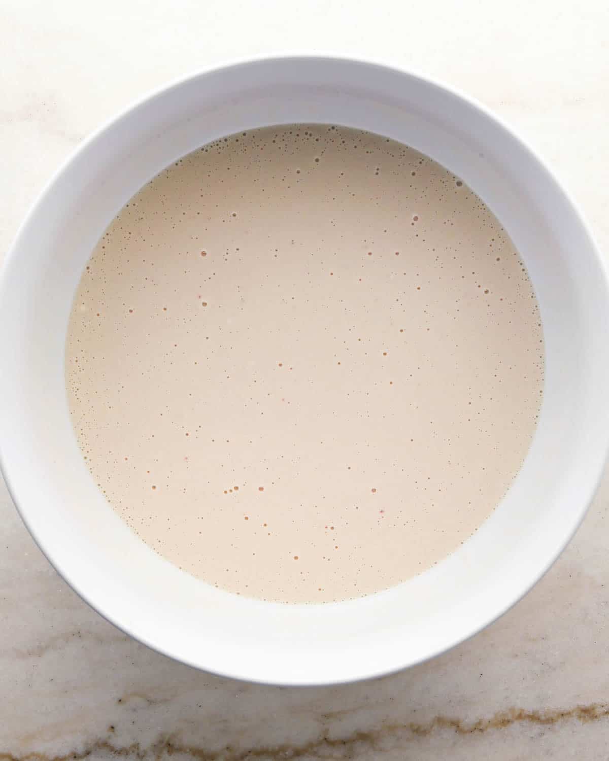 making chocolate raspberry cake - combined wet ingredients in a glass mixing bowl