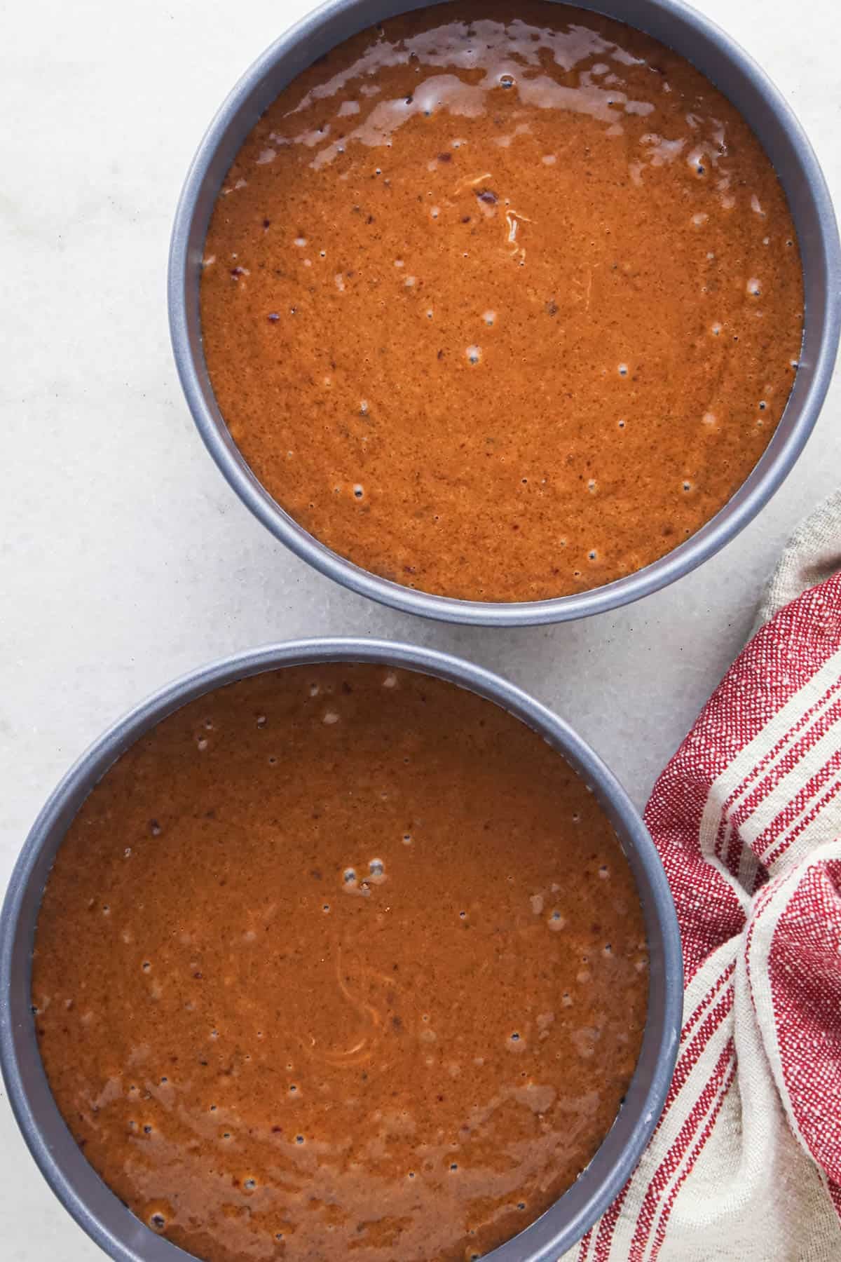 making chocolate raspberry cake - batter in two round cake pans before baking