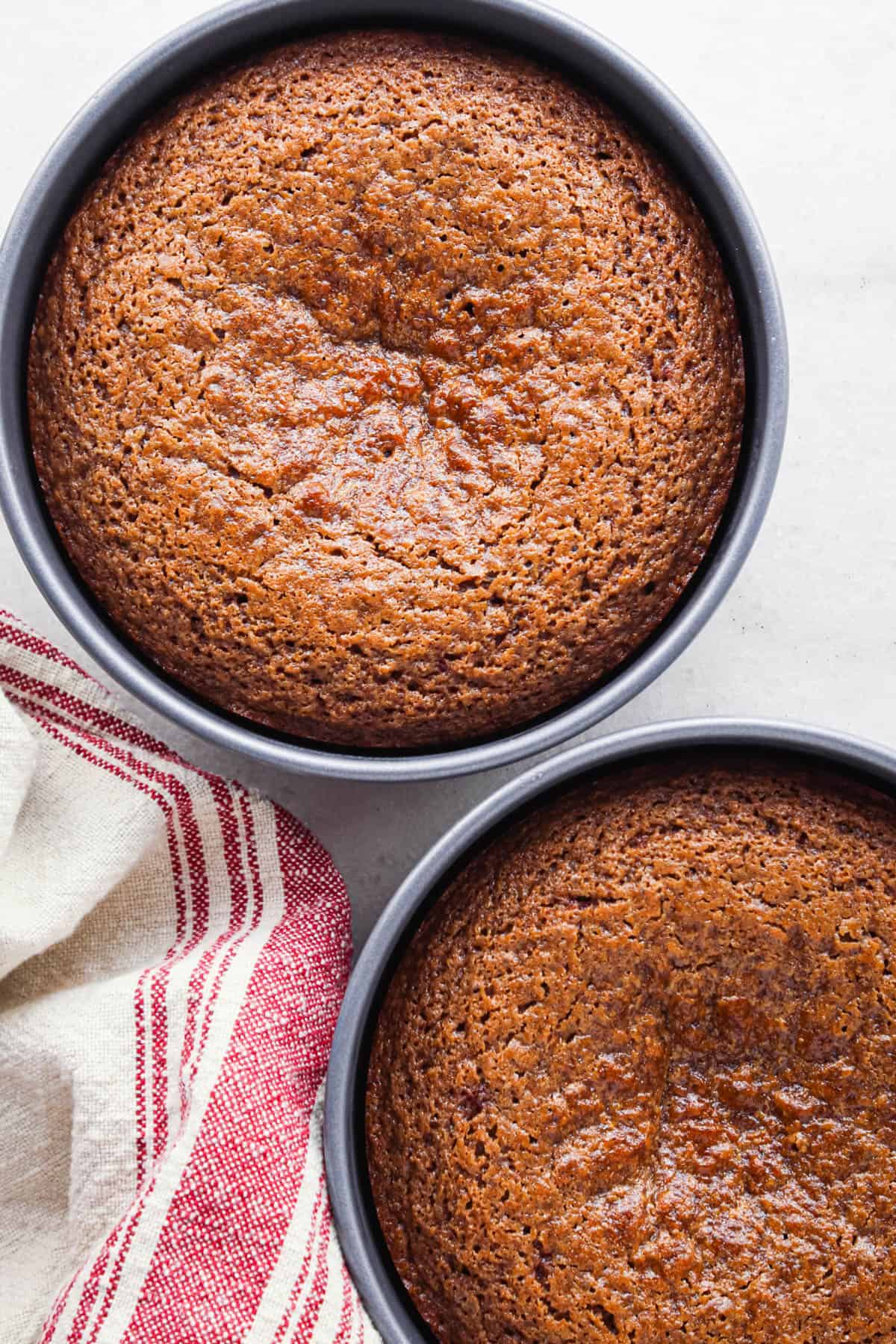 chocolate raspberry cake in two round cake pans after baking