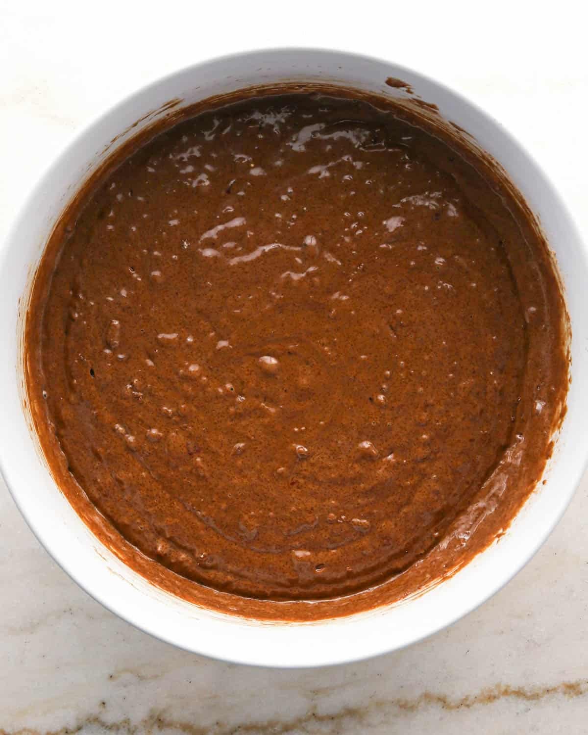 making chocolate raspberry cake - batter in a glass bowl