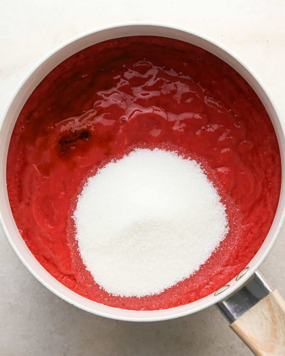 making chocolate raspberry cake filling - ingredients in a white saucepan before mixing