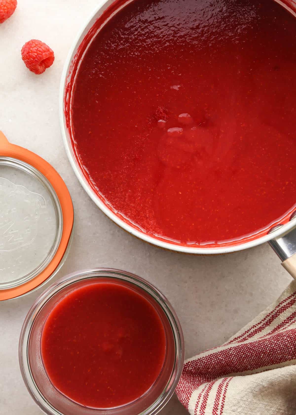 making raspberry filling for chocolate raspberry cake - ½ cup of the mixture removed from the pan and put into a glass jar to be used in the frosting.