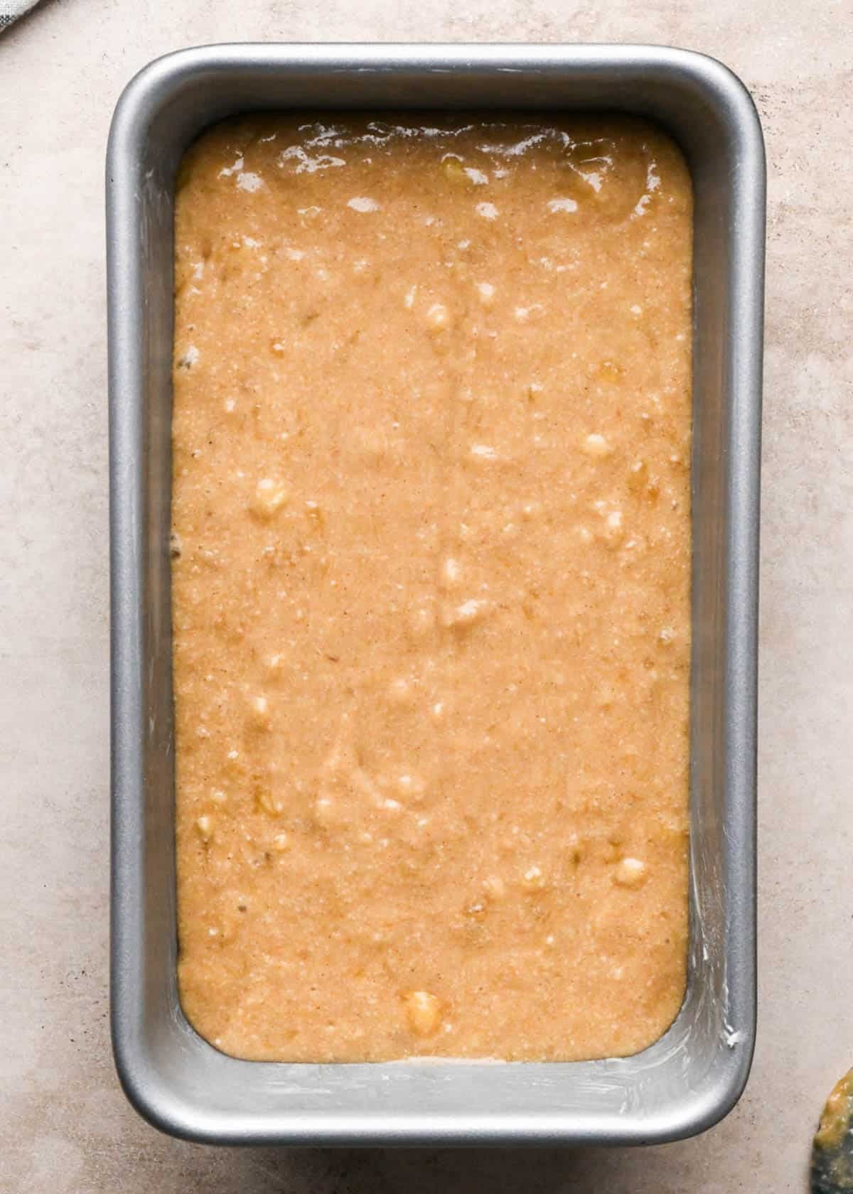 making brown butter banana bread - batter in a metal loaf pan before baking