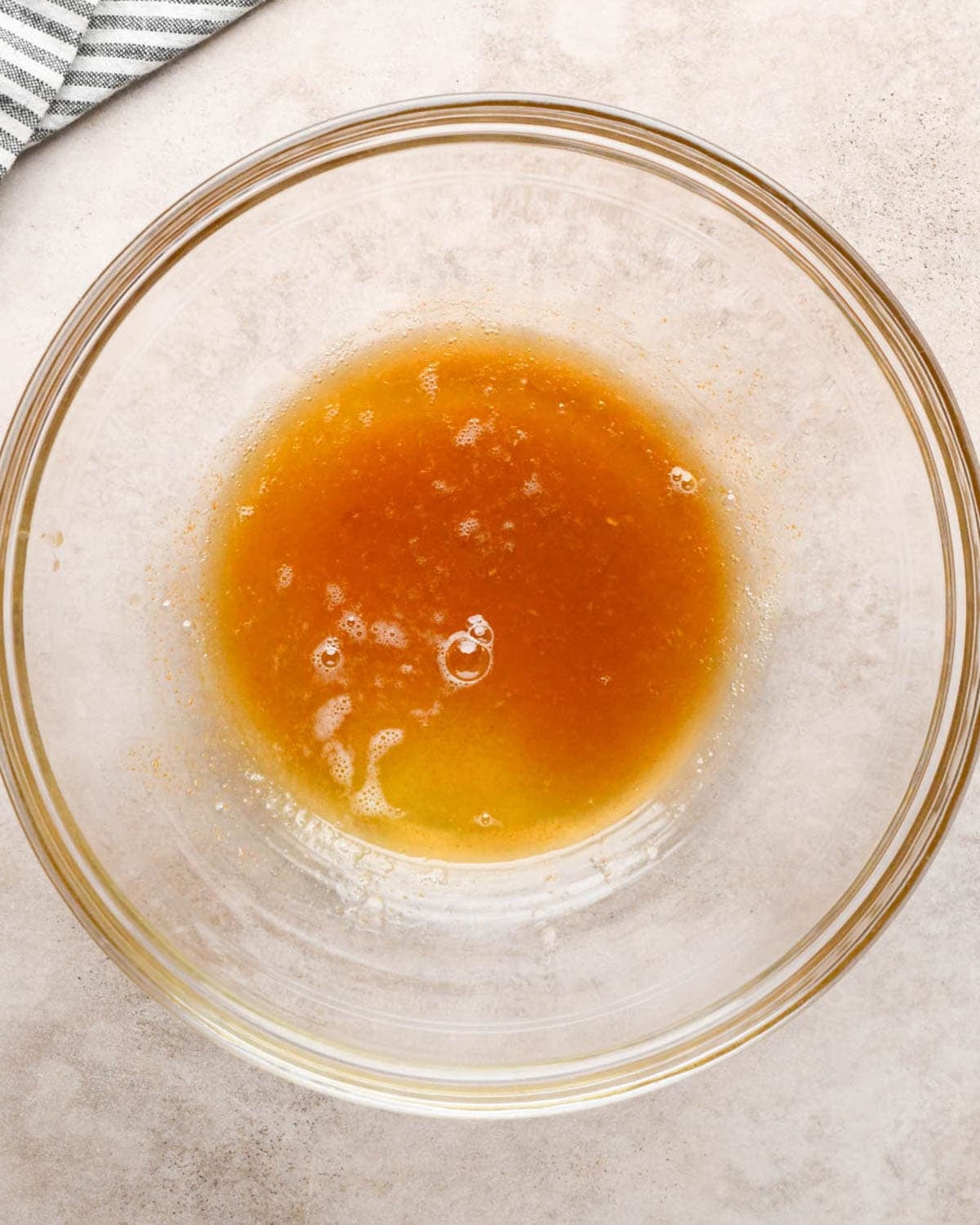 making brown butter banana bread - browned butter in a glass bowl